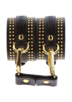 Wrist Cuffs studded black-gold PU-Leather luxurious with golden-colored round Rivets & connecting Strap buy